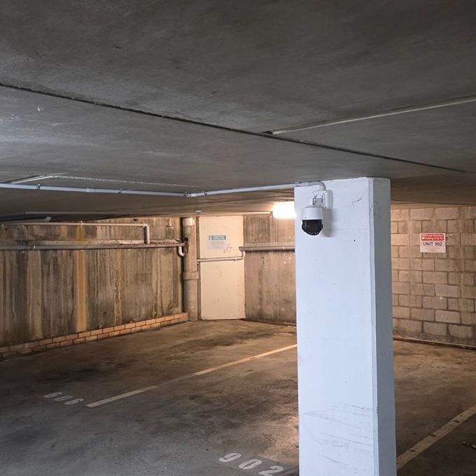 CCTV security camera installed in an undercover car park.